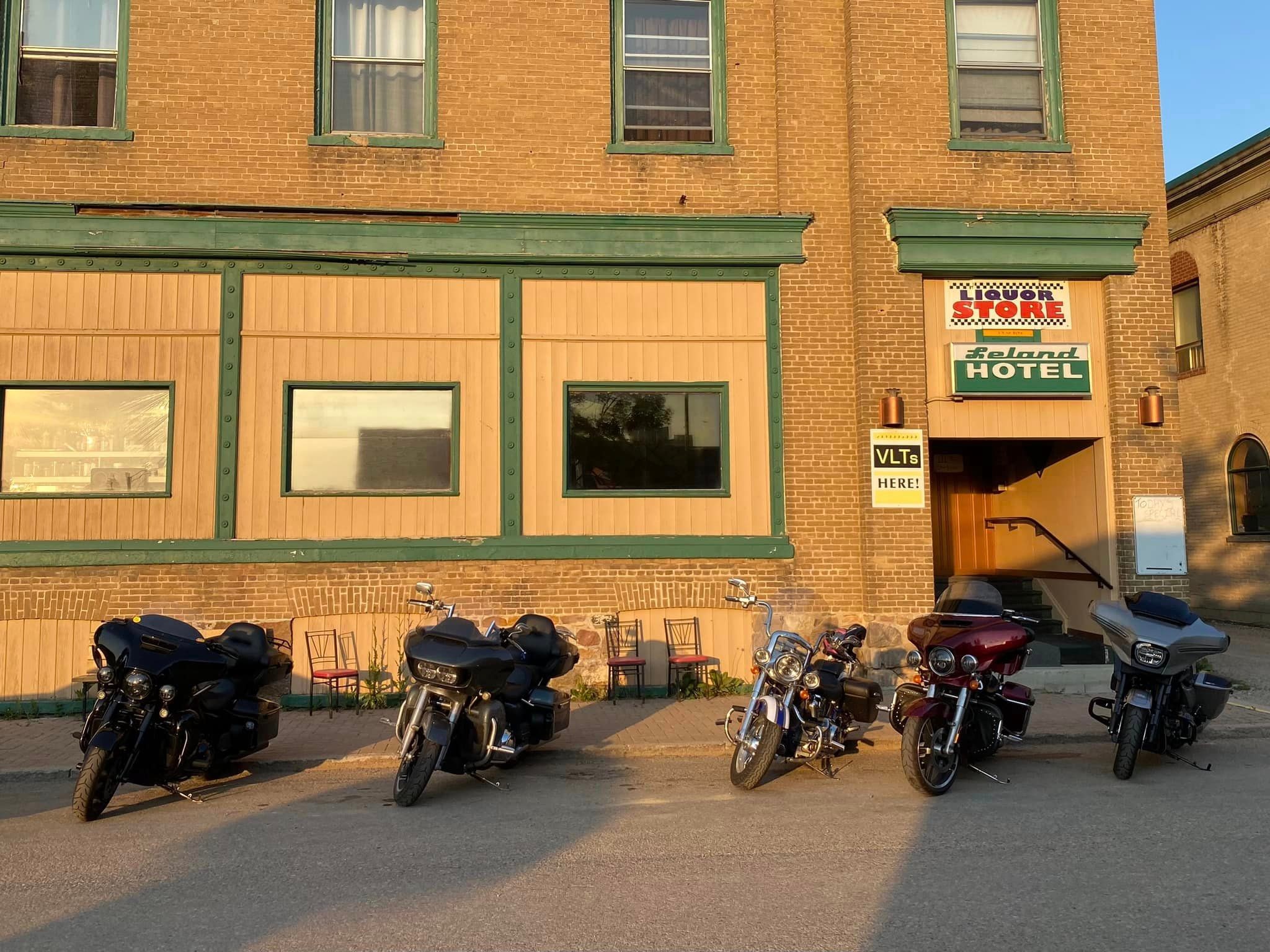 Bikes parked outside the Leland Hotel liquor store on a chapter ride