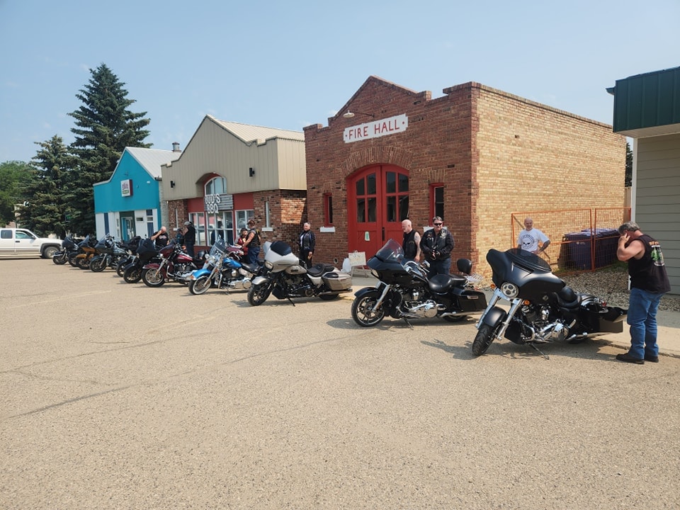 Chapter members and bikes stopped at a small-town fire hall