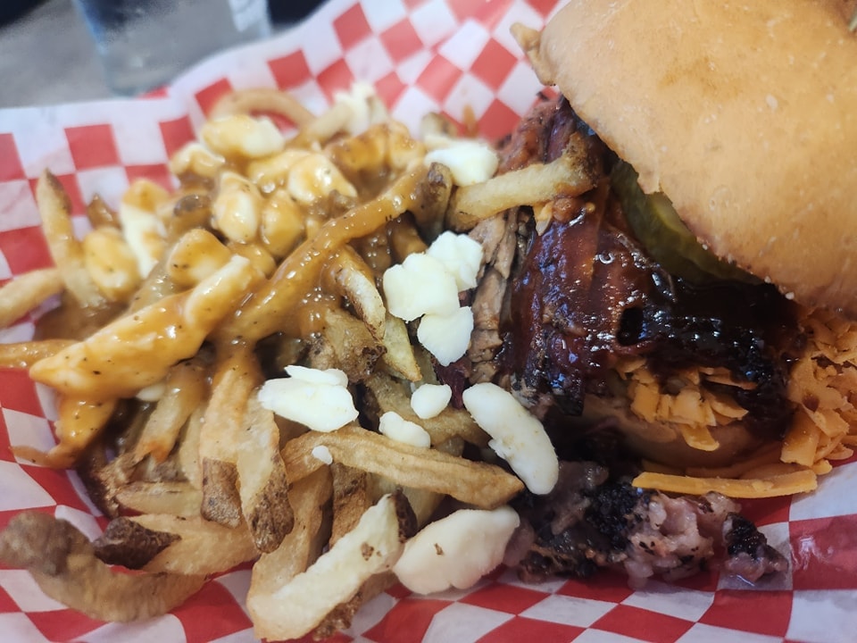 BBQ sandwich with poutine fries at a chapter ride stop
