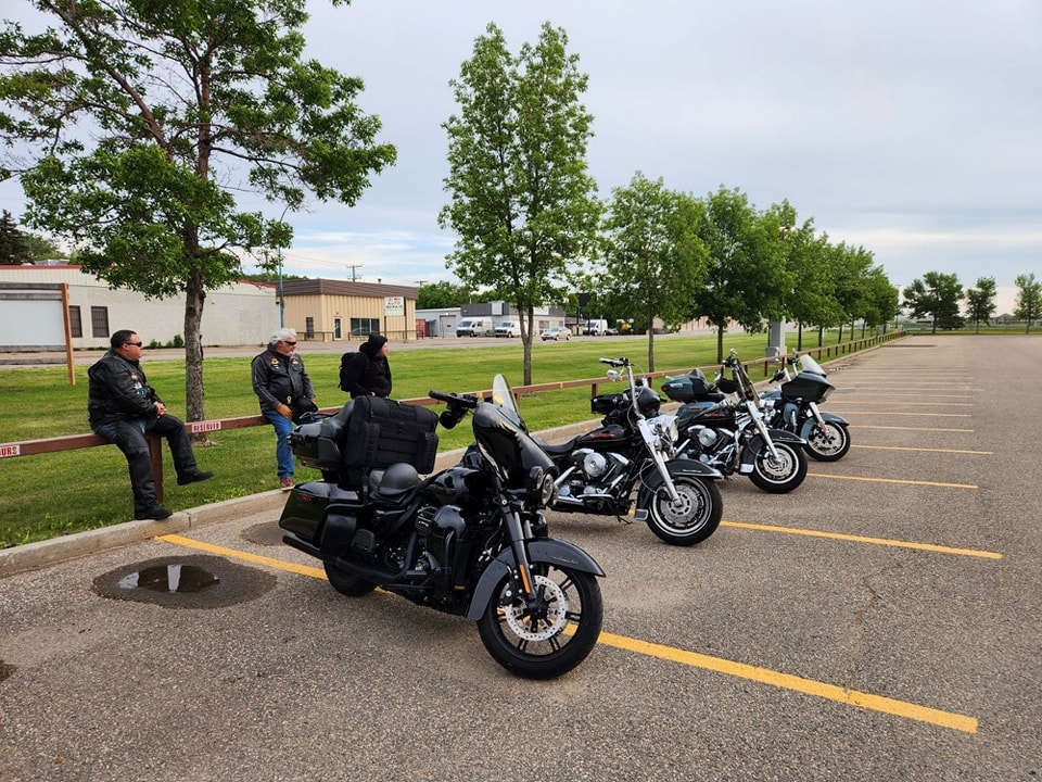 Regina HOG Chapter 9252 bikes parked at a small town stop