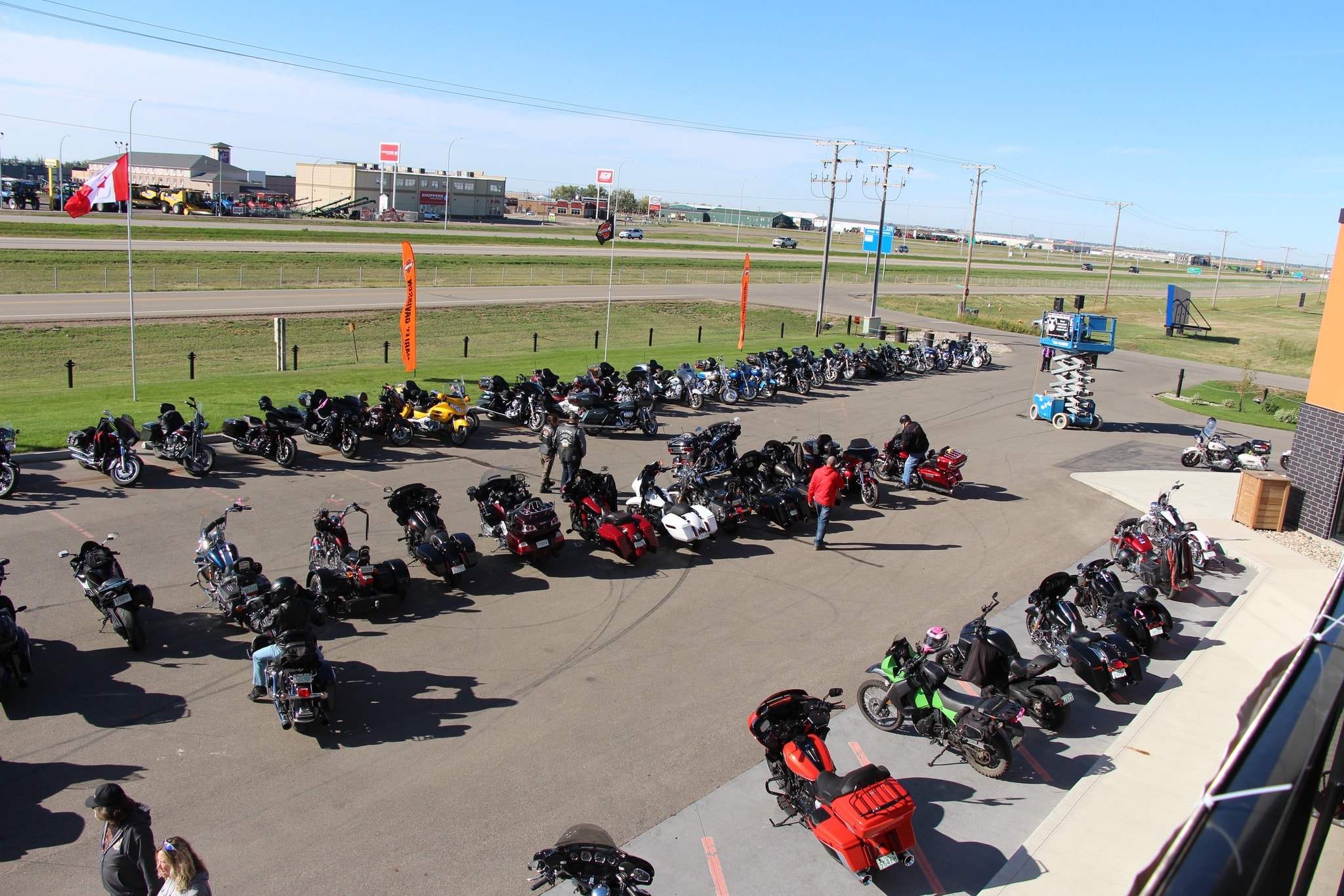 Aerial view of dozens of bikes packed into the Prairie Harley-Davidson parking lot for the 2024 Breast Cancer Awareness Ride