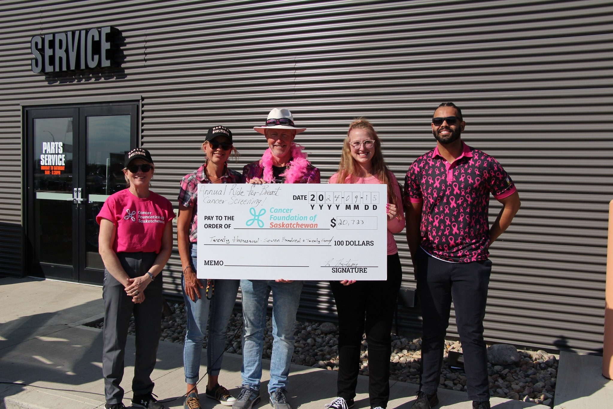 Five people holding a $20,723 cheque for the Cancer Foundation of Saskatchewan at the 2024 Annual Ride for Breast Cancer Screening